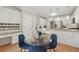 Well-lit kitchen features white cabinets, stainless steel appliances, and a breakfast nook with seating at 2622 Murdock Rd, Marietta, GA 30062