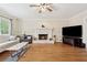 Comfortable living room with a fireplace, hardwood floors, and a large window for natural light at 2622 Murdock Rd, Marietta, GA 30062