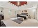Spacious main bedroom with a tray ceiling, large windows, and neutral decor for a peaceful retreat at 2622 Murdock Rd, Marietta, GA 30062
