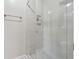 Contemporary shower with white marble-look tiling and glass door at 2622 Murdock Rd, Marietta, GA 30062