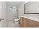 Bathroom featuring a glass enclosed walk-in shower, wood cabinets, and gray flooring at 2622 Murdock Rd, Marietta, GA 30062