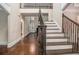 Grand foyer featuring hardwood floors, elegant staircase, and open layout at 4519 Mossey Dr, Lithonia, GA 30038