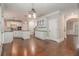 Spacious kitchen and dining area with white cabinetry, hardwood floors, and modern appliances at 4519 Mossey Dr, Lithonia, GA 30038