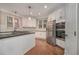 Modern kitchen featuring stainless steel appliances, custom cabinetry, and granite countertops at 4519 Mossey Dr, Lithonia, GA 30038