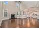 Open-concept living room with a fireplace, hardwood floors, and natural light at 4519 Mossey Dr, Lithonia, GA 30038
