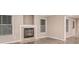 Cozy living room featuring a fireplace and bright windows, creating a warm and inviting atmosphere at 4519 Mossey Dr, Lithonia, GA 30038