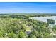 Panoramic aerial view of a lakeside property with lush forests, a golf course, and stunning natural beauty at 5008 Monticello Dr, Villa Rica, GA 30180