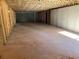 Unfinished basement with concrete floor and exposed wooden ceiling, ready for customization at 5008 Monticello Dr, Villa Rica, GA 30180