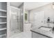 Modern bathroom features glass-enclosed shower, standalone tub, and sleek fixtures at 5008 Monticello Dr, Villa Rica, GA 30180