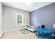 Cozy bedroom with a small bed, a table, and view of outside at 5008 Monticello Dr, Villa Rica, GA 30180
