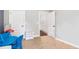 A bedroom is furnished with a table, a small shelf and a view of the hallway at 5008 Monticello Dr, Villa Rica, GA 30180