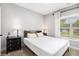 Cozy bedroom with neutral walls, dark wood furniture, and a window view at 5008 Monticello Dr, Villa Rica, GA 30180