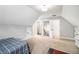 Spacious bonus room featuring a bed and access to other areas of the home at 5008 Monticello Dr, Villa Rica, GA 30180