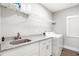 Well-equipped laundry room with granite countertops, white cabinets, and modern washer/dryer at 5008 Monticello Dr, Villa Rica, GA 30180