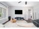 Comfortable living room featuring a ceiling fan, a large window, and wood-look floors at 5008 Monticello Dr, Villa Rica, GA 30180
