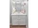 Charming powder room with vanity, mirror, and decor at 989 Brownstone Ln # 16, Marietta, GA 30008