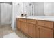 Clean bathroom featuring a long vanity with ample storage and a shower/tub combo at 989 Brownstone Ln # 16, Marietta, GA 30008