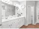 Bathroom with dual sinks and decorative mirrors at 989 Brownstone Ln # 16, Marietta, GA 30008