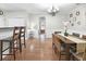 Bright dining room featuring hardwood floors, wainscoting, and a stylish chandelier at 989 Brownstone Ln # 16, Marietta, GA 30008