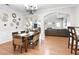 Open dining room and adjacent living room and kitchen with hardwood floors and neutral paint at 989 Brownstone Ln # 16, Marietta, GA 30008