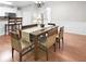Dining room features include hardwood floors and classic wainscotting detail at 989 Brownstone Ln # 16, Marietta, GA 30008
