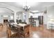 An open dining room boasts a chandelier, hardwood floors and flows into the kitchen and living room at 989 Brownstone Ln # 16, Marietta, GA 30008