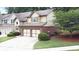 Charming home with a well-manicured lawn, a two-car garage, and beautiful exterior detailing at 989 Brownstone Ln # 16, Marietta, GA 30008