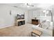 Cozy living room with plush carpet, ceiling fan, and ample natural light from the shuttered windows at 989 Brownstone Ln # 16, Marietta, GA 30008