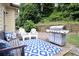 Outdoor patio with grill and patio furniture, perfect for entertaining guests at 989 Brownstone Ln # 16, Marietta, GA 30008