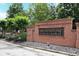 Attractive brick sign for Brownstone Square neighborhood, surrounded by greenery at 989 Brownstone Ln # 16, Marietta, GA 30008