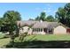 Spacious backyard featuring a large lawn, wooden deck, and charming patio area at 1311 N Brandy Se Shls, Conyers, GA 30013