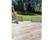 Beautiful backyard view from wood deck with lush lawn and mature trees at 1311 N Brandy Se Shls, Conyers, GA 30013