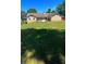 Spacious backyard featuring a large lawn, wooden deck, and charming patio area at 1311 N Brandy Se Shls, Conyers, GA 30013