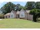 Beautiful single-story brick home with large windows and a well-maintained front lawn at 1311 N Brandy Se Shls, Conyers, GA 30013
