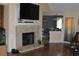 Cozy living room features a brick fireplace and open layout into the dining area at 1311 N Brandy Se Shls, Conyers, GA 30013