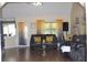 Living room featuring a large window, neutral paint and a leather couch at 1311 N Brandy Se Shls, Conyers, GA 30013