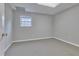 Bedroom featuring neutral walls and carpet with a window for natural light at 1847 Oak Rd, Snellville, GA 30078
