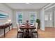 Elegant dining room with hardwood floors, neutral walls, and stylish furniture for sophisticated entertaining at 1847 Oak Rd, Snellville, GA 30078