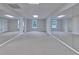 Large fitness room with multiple mirrors and neutral carpet at 1847 Oak Rd, Snellville, GA 30078