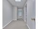 Finished basement hallway featuring neutral walls, carpet, and access to additional rooms at 1847 Oak Rd, Snellville, GA 30078