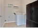 Bright laundry area features modern washer and dryer, with overhead storage for convenience at 1847 Oak Rd, Snellville, GA 30078
