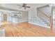 Living space with hardwood floors, fireplace, and stairs to the upper level at 1847 Oak Rd, Snellville, GA 30078