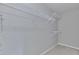 Organized walk-in closet with multiple levels of shelving for ample storage space at 1847 Oak Rd, Snellville, GA 30078