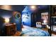Bedroom featuring decor, wood-look floors, ceiling fan and cozy atmosphere at 2410 Clock Face Ct, Lawrenceville, GA 30043