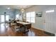 Open-concept dining area showcasing hardwood floors and natural light at 2410 Clock Face Ct, Lawrenceville, GA 30043