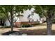 Inviting two-story home featuring red brick accents, green landscaping, and a side entry garage at 2410 Clock Face Ct, Lawrenceville, GA 30043