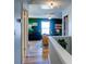 Inviting hallway with views into the second living area, complete with updated flooring and stylish decor at 2410 Clock Face Ct, Lawrenceville, GA 30043