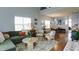 Bright, open living room area with hardwood floors and modern furnishings at 2410 Clock Face Ct, Lawrenceville, GA 30043