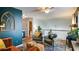 Spacious living room with hardwood floors, ceiling fan, and decor at 2410 Clock Face Ct, Lawrenceville, GA 30043
