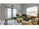Cozy living room filled with natural light and comfortable seating at 2410 Clock Face Ct, Lawrenceville, GA 30043